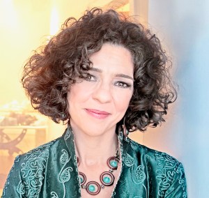 lua_hadar_teal_jacket_yellow_room_lo_cropped